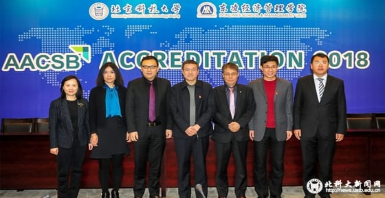 A group of people posing for the camera

Description generated with very high confidence